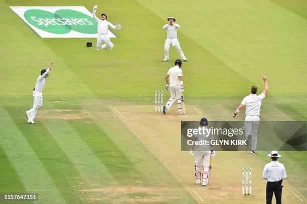 England's Moeen Ali is caught behind by Ireland's Gary Wilson off the bowling of Ireland's Boyd Rankin for nine on the second day of the first...