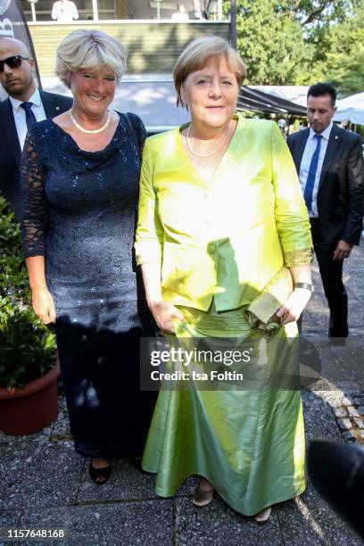 German politician Monika Gruetters and German Federal Chancellor Angela Merkel during the Bayreuth Festival 2019 opening premiere "Tannhaeuser" at...