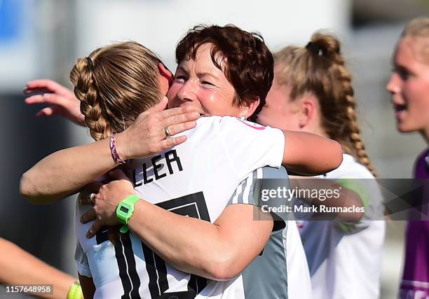 Germany Women's U-19 head coach Maren Meinert embraces Marie Muller of Germany at the final whistle during of the UEFA Women's U-19 European...