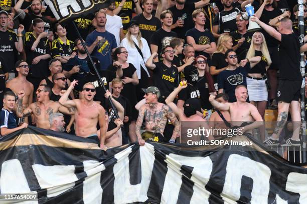Supporters of AIK cheer for their team during the Second qualifying round of the UEFA Champions League between NK Maribor and AIK Football at the...