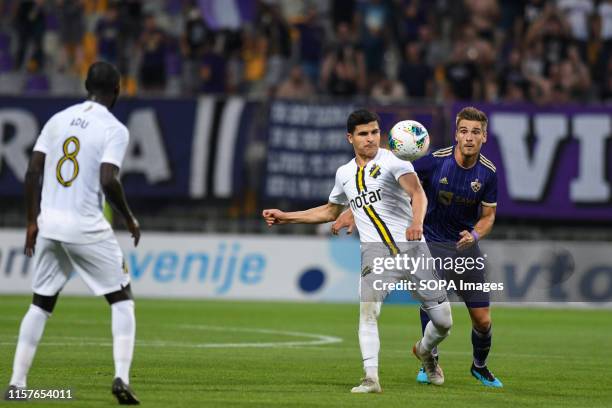 Tarik Elyounoussi of AIK and Blaz Vrhovec of Maribor in action during the Second qualifying round of the UEFA Champions League between NK Maribor and...