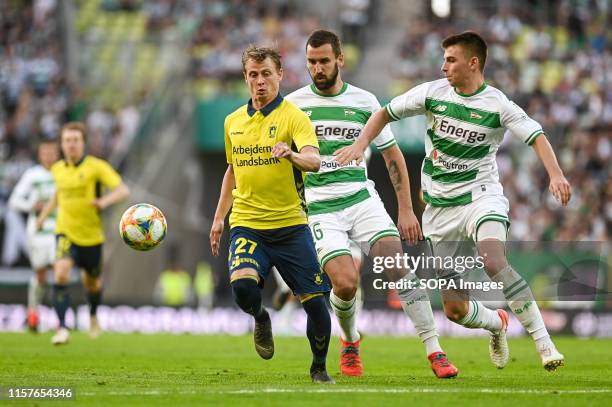 Simon Hedlund from Brondby IF , Blazej Augustyn from Lechia Gdansk and Karol Fila from Lechia Gdansk are seen in action during the UEFA Europa League...