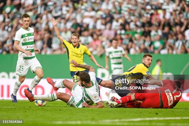Blazej Augustyn from Lechia Gdansk Kamil Wilczek from Brondby IF and Dusan Kuciak from Lechia Gdansk are seen in action during the UEFA Europa League...