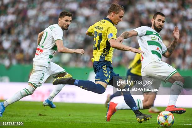 Filip Mladenovic from Lechia Gdansk Simon Hedlund from Brondby IF and Blazej Augustyn from Lechia Gdansk are seen in action during the UEFA Europa...