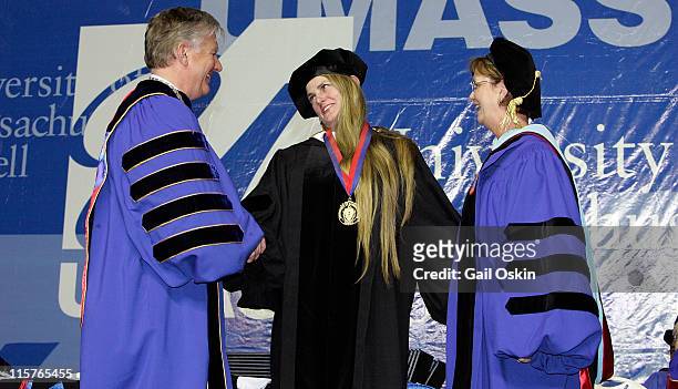 Bonnie Comley receives a distinguished alumni award from Chancellor Marty Meehan and Vice Chancellor Jacqueline F. Maloney of the University of...