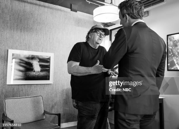 Episode 863 -- Pictured: Filmmaker Michael Moore talks with host Seth Meyers backstage on July 25, 2019 --