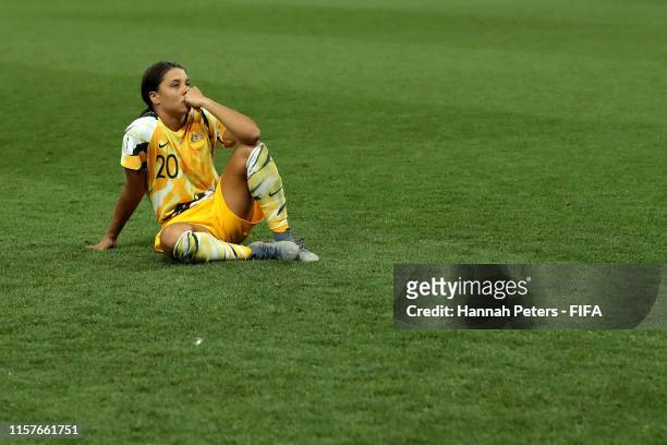 Sam Kerr of Australia looks dejected after losing the penalty shoot out during the 2019 FIFA Women's World Cup France Round Of 16 match between...
