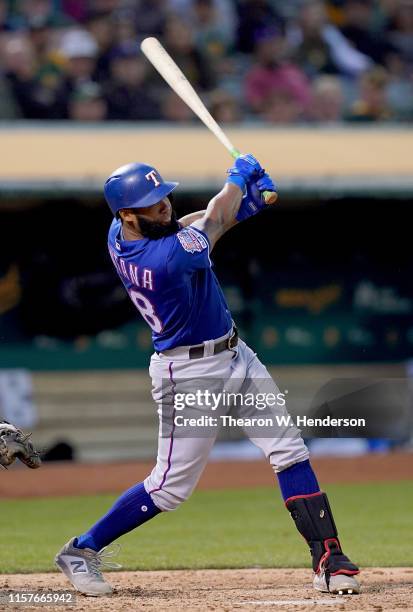 Danny Santana of the Texas Rangers hits a base loaded two-run rbi double against the Oakland Athletics in the top of the fifth inning at Ring Central...