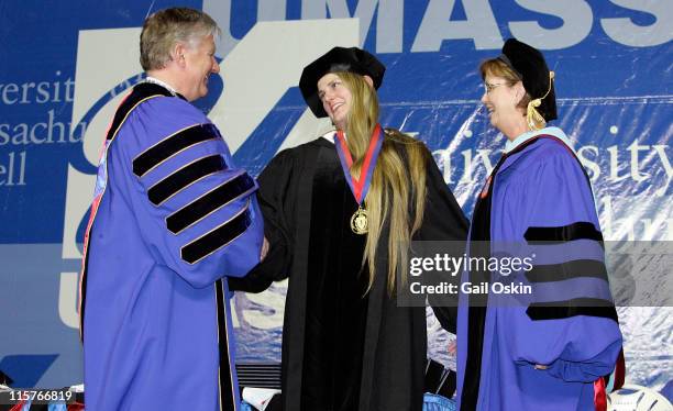 Bonnie Comley receives a distinguished alumni award from Chancellor Marty Meehan and Vice Chancellor Jacqueline F. Maloney of the University of...