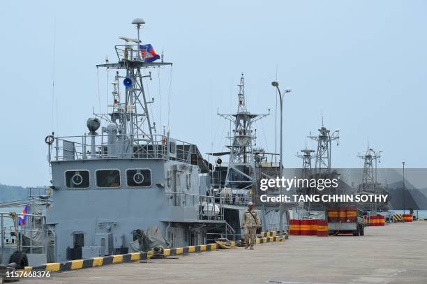 Cambodian navy boats are berthed at a jetty in Ream naval base in Preah Sihanouk province during a government organized media tour on July 26, 2019....