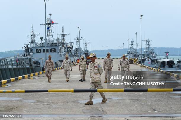 Cambodian navy personnel walk on a jetty in Ream naval base in Preah Sihanouk province during a government organized media tour on July 26, 2019. -...