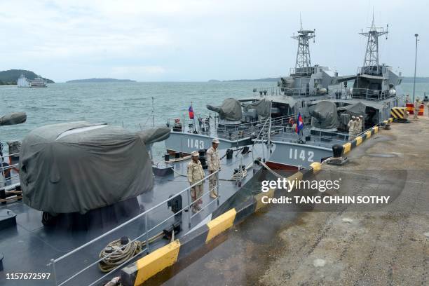 Cambodian naval personnel are seen on boats berthed at a jetty at the Ream naval base in Preah Sihanouk province on July 26, 2019 during a government...