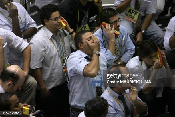 Stock trader reacts as he negotiates in the iBovespa future index pit during the morning session, at the Mercantile & Futures Exchange , in Sao...