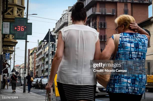 Sign of a pharmarcy shows a temperature of 36 Celsius degrees . An excessive heating warning has been designated in 13 Italian cities.