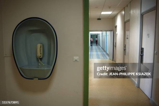 Picture taken 12 December 2006 in Saint Jean de Dieu pyschiatric hospital in Lyon shows a telephone in a hallway. Created by the brothers of Saint...