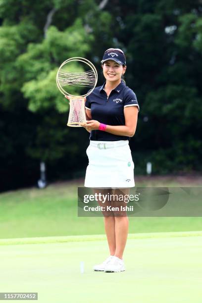 Winner Hikari Fujita of Japan poses with the trophy after winning the tournament during the final round of the Yupiteru Shizuoka Shimbun SBS Ladies...