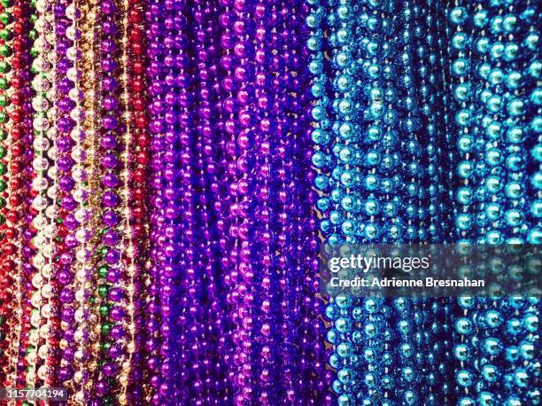 party beads - mardi gras background stock pictures, royalty-free photos & images