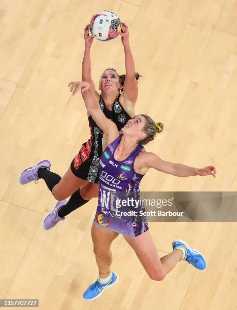 Kelsey Browne of the Magpies and Gabi Simpson of the Firebirds compete for the ball during the round 9 Super Netball match between the Magpies and...