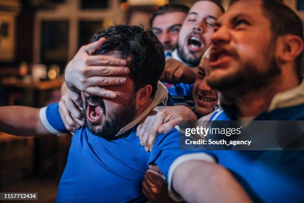 group of men in pub - hooligan stock pictures, royalty-free photos & images