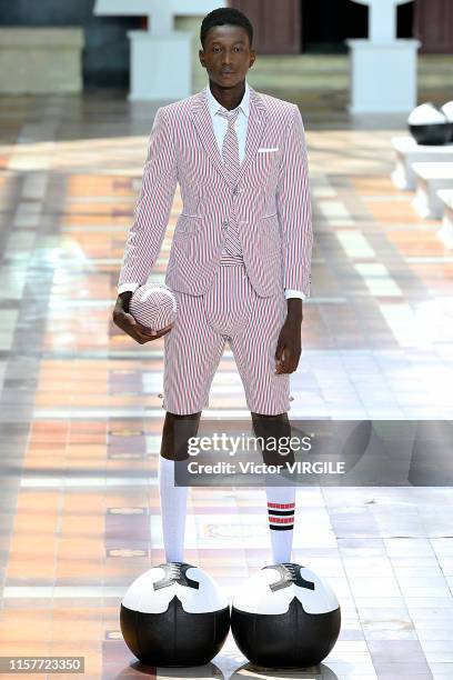 Model walks the runway during the Thom Browne Menswear Spring Summer 2020 fashion show as part of Paris Fashion Week on June 22, 2019 in Paris,...