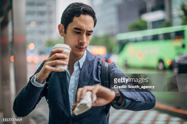 businessman in the city - eating on the move stock pictures, royalty-free photos & images