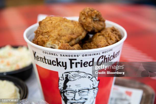 Bucket of fried chicken is arranged for a photograph at a Yum! Brands Inc. Kentucky Fried Chicken restaurant in Norwell, Massachusetts, U.S., on...