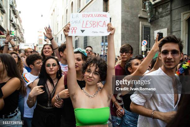 Activist shows a sign: "La rivoluzione sarà lesbica" during the 12th Mediterranean Pride of Naples on June 22, 2019 in Naples, Italy. The...