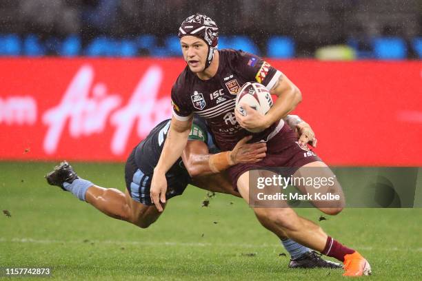 Kalyn Ponga of the Maroons is tackled during game two of the 2019 State of Origin series between the New South Wales Blues and the Queensland Maroons...