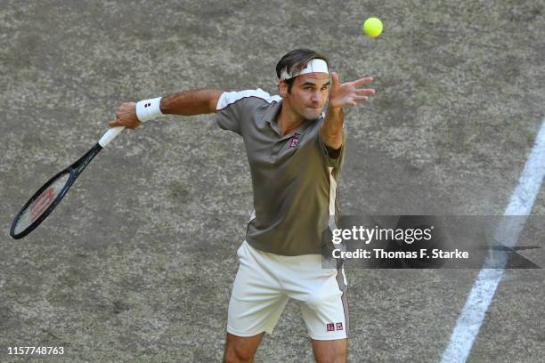 Roger Federer of Switzerland serves in the final match against David Goffin of Belgium during day 7 of the Noventi Open at Gerry Weber Stadium on...