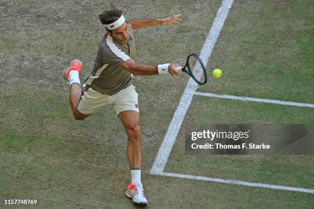 Roger Federer of Switzerland plays a forehand in the final match against David Goffin of Belgium during day 7 of the Noventi Open at Gerry Weber...