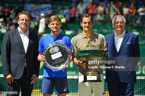 Tournament director Ralf Weber, David Goffin of Belgium, Roger Federer of Switzerland and CEO of Noventi Dr. Hermann Sommer pose for photographers...