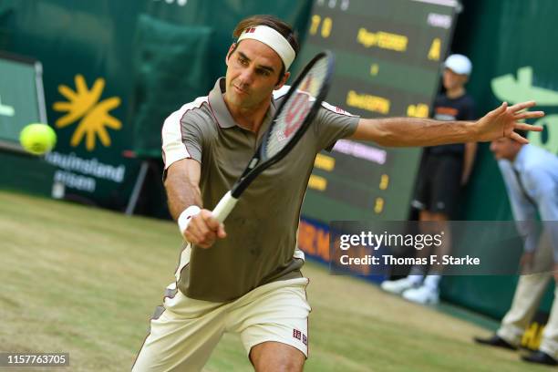 Roger Federer of Switzerland plays a backhand in the final match against David Goffin of Belgium during day 7 of the Noventi Open at Gerry Weber...