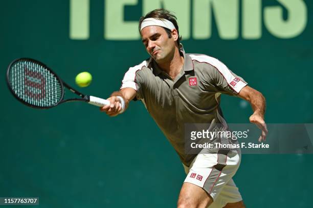 Roger Federer of Switzerland plays a backhand in the final match against David Goffin of Belgium during day 7 of the Noventi Open at Gerry Weber...