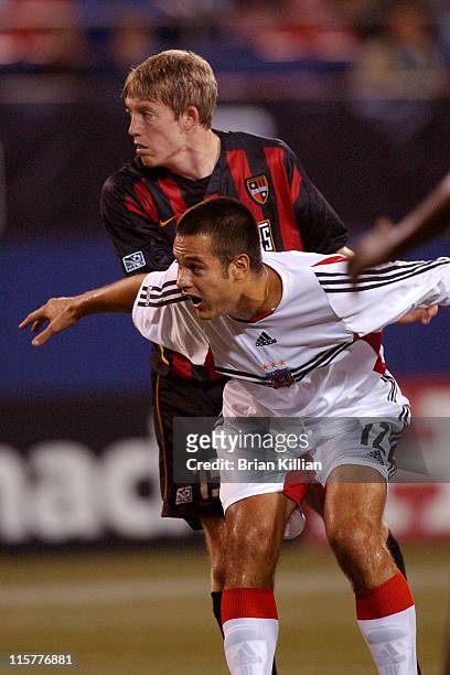 United Defender Mike Petke tries to box out New York / New Jersey Metrostars Forward John Wolyniec at Giants Stadium in East Rutherford, NJ on...