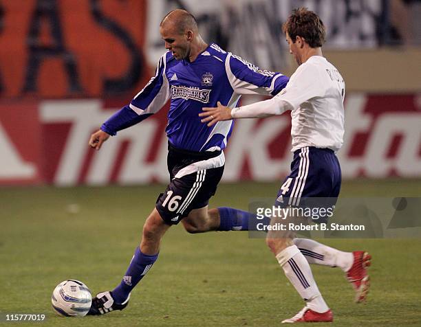 San Jose's Craig Waibel defends against New England's Steve Ralston as the San Jose Earthquakes tied the New England Revolution 2-2 at Spartan...