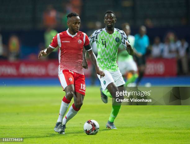 Of Nigeria and SAIDO BERAHINO of Burundi during the 2019 Africa Cup of Nations Group B match between Nigeria and Burundi at Alexandria Stadium on...