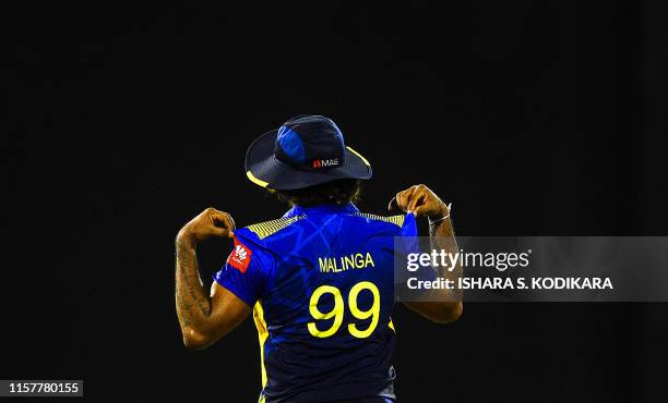 Sri Lankan cricketer Lasith Malinga looks on during the first One Day International cricket match between Sri Lanka and Bangladesh at the R.Premadasa...