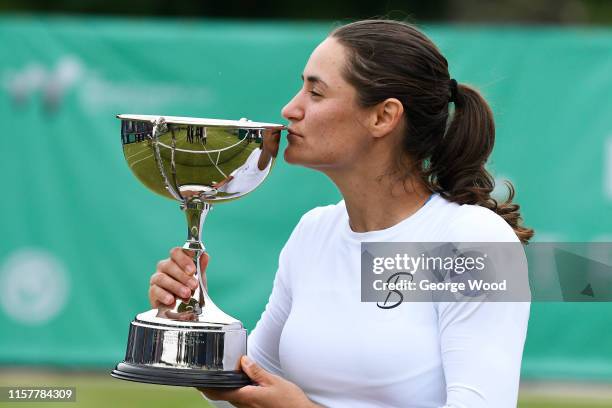 Monica Niculescu of Romania kisses the trophy after winning her women's final against Tímea Babos of Hungary during the Ilkley Trophy - Day Seven at...