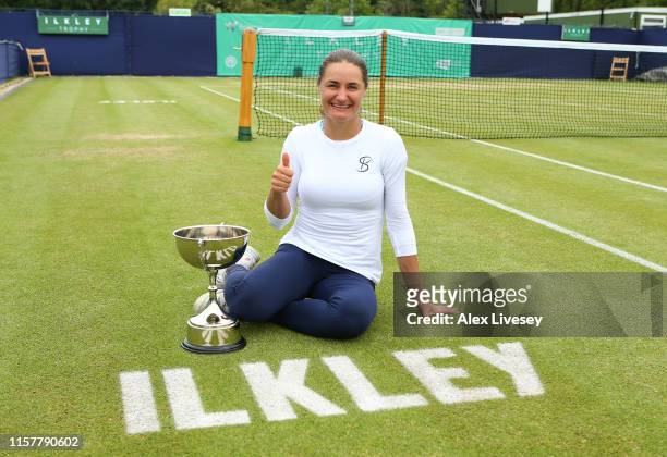 Monica Niculescu of Romania poses with the Ilkley Trophy after her victory over Timea Babos of Hungary during the Women's Final at Ilkley Lawn Tennis...