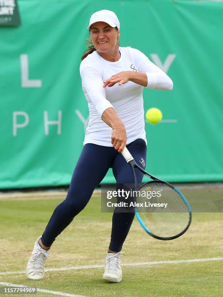 Monica Niculescu of Romania in action during her victory over Timea Babos of Hungary in the Women's Final at Ilkley Lawn Tennis & Squash Club on June...