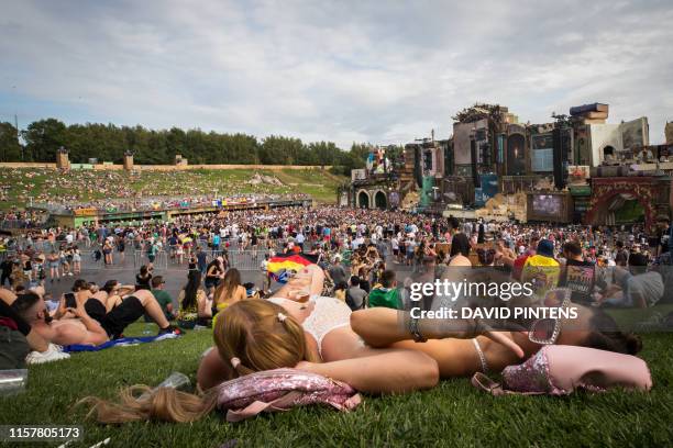 People of tomorrow have a rest moment at mainstage during the first day of the Tomorrowland music festival, Friday 19 July 2019. The 15th edition of...