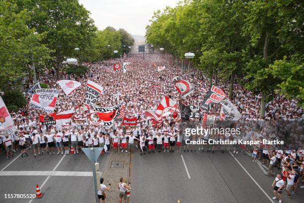 Fans are walking together to the stadium prior to the Second Bundesliga match between VfB Stuttgart and Hannover 96 at Mercedes-Benz Arena on July...