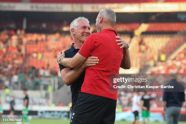 Tim Walter, Head coach of VfB Stuttgart shakes hands with Mirko Slomka, Head coach of Hannover 96 prior to the Second Bundesliga match between VfB...