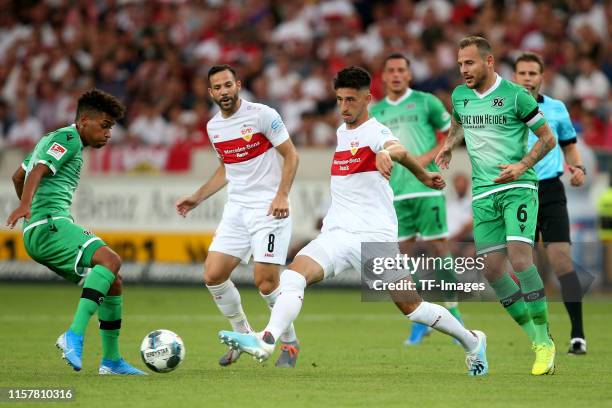 Linton Maina of Hannover 96, Atakan Karazor of VfB Stuttgart and Marvin Bakalorz of Hannover 96 battle for the ball during the Second Bundesliga...