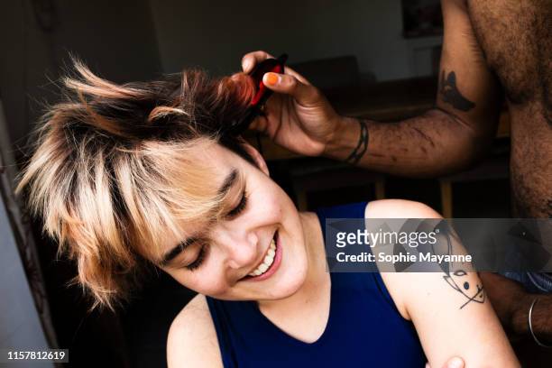 A young LGBT couple head shaving