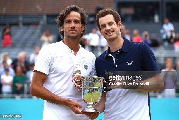 Andy Murray of Great Britain and partner Feliciano Lopez of Spain celebrate victory with the winners trophy in the mens doubles final against Rajeev...