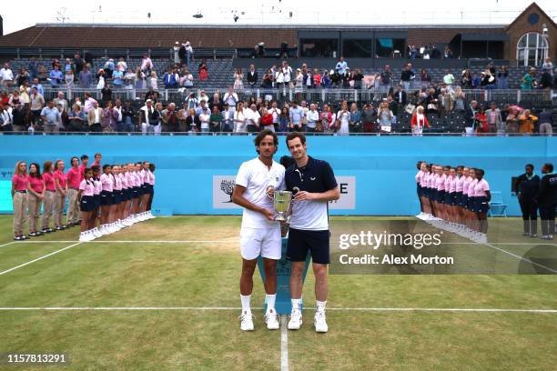 Andy Murray of Great Britain and partner Feliciano Lopez of Spain celebrate victory with the winners trophy in the mens doubles final against Rajeev...