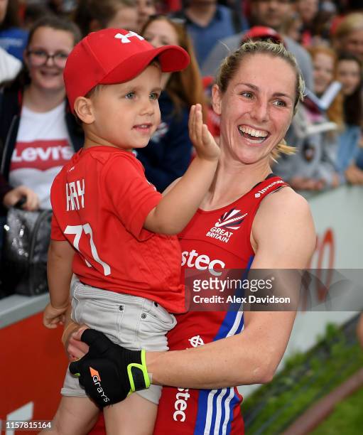 Jo Hunter of Great Britain looks on with her son during the Women's FIH Field Hockey Pro League match between Great Britain and New Zealand at...