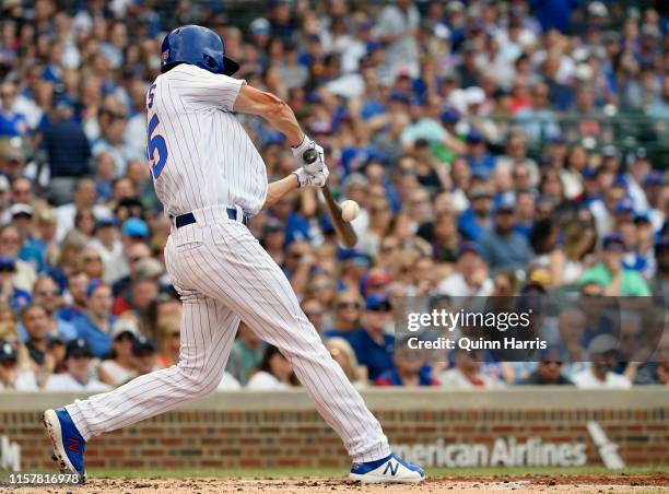 Cole Hamels of the Chicago Cubs hits a RBI single in the second inning against the New York Mets at Wrigley Field on June 23, 2019 in Chicago,...