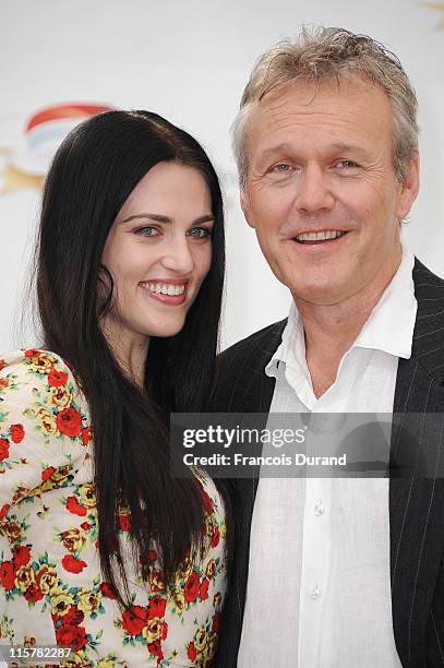 Anthony Head and Katie McGrath pose during a photocall for the TV show 'The Adventures Of Merlin' during the 2011 Monte Carlo Television Festival...